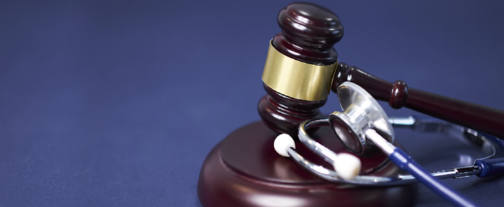 Gavel and mallet with a stethoscope