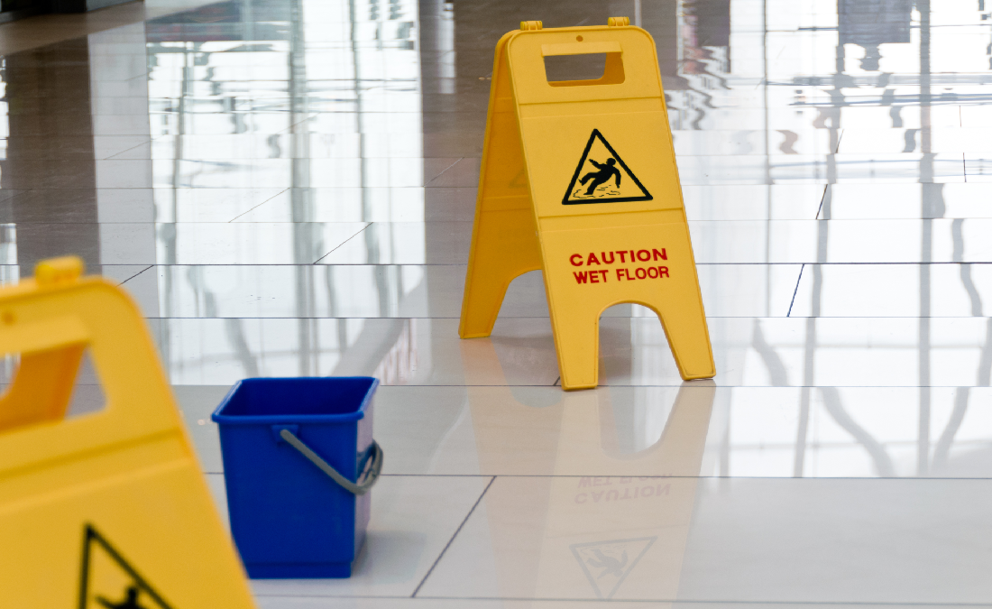 Caution wet floor sign on shiny floors