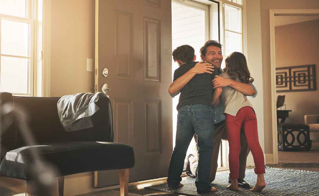 Kids visiting and hugging father