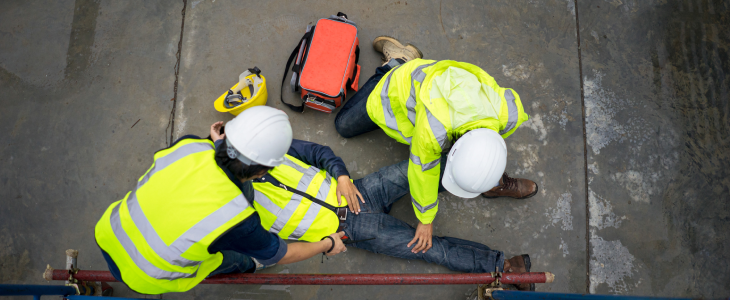Construction worker on the floor after an accident